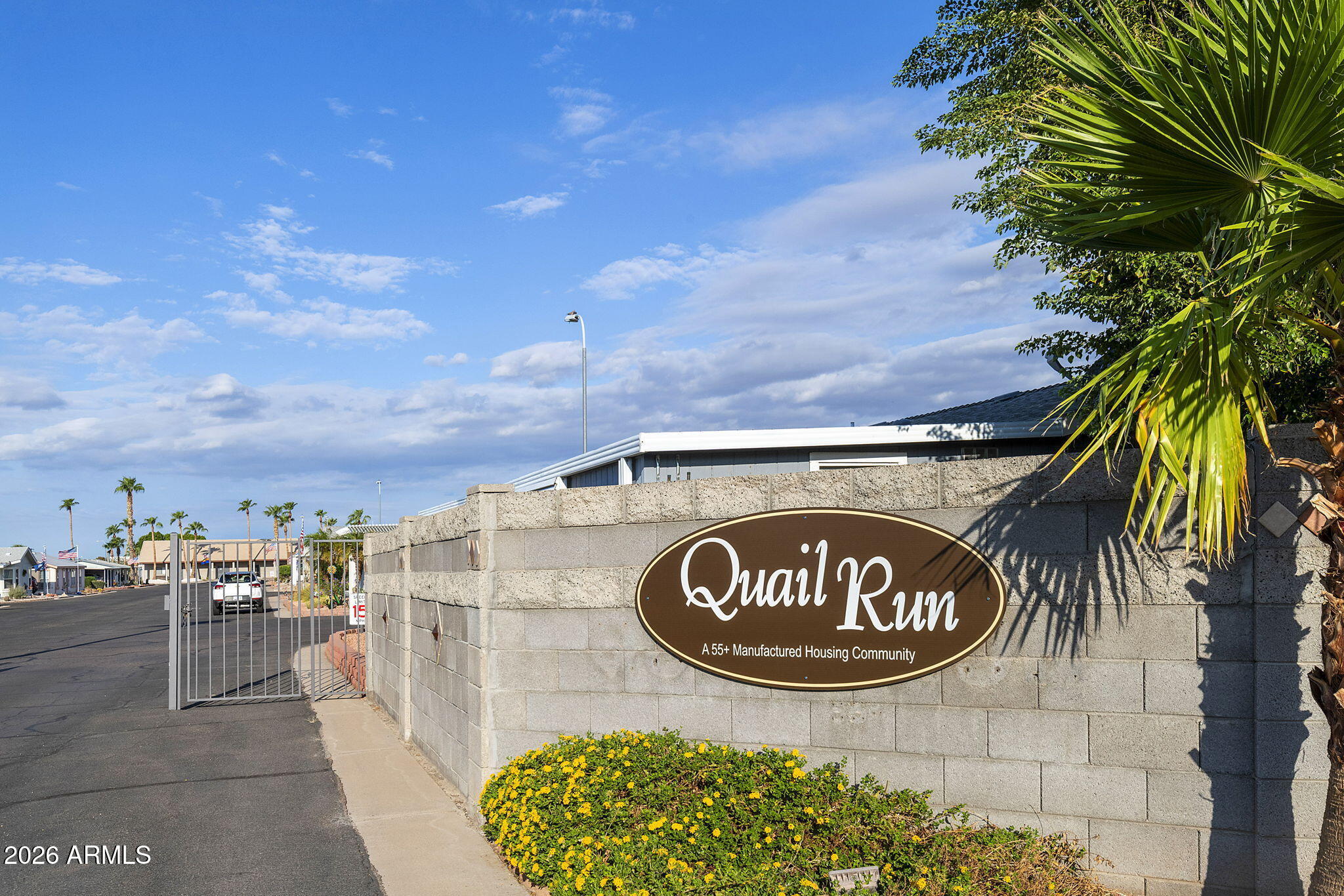 3700 South Tomahawk Road, Unit 73 Apache Junction, AZ 85119 - Photo 36 of 49 a view of outdoor space with signage and flags