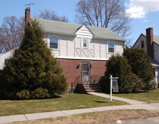 40 Cloverdale Road Newton, MA 02461 - Photo 1 of 1 a front view of a house with a yard