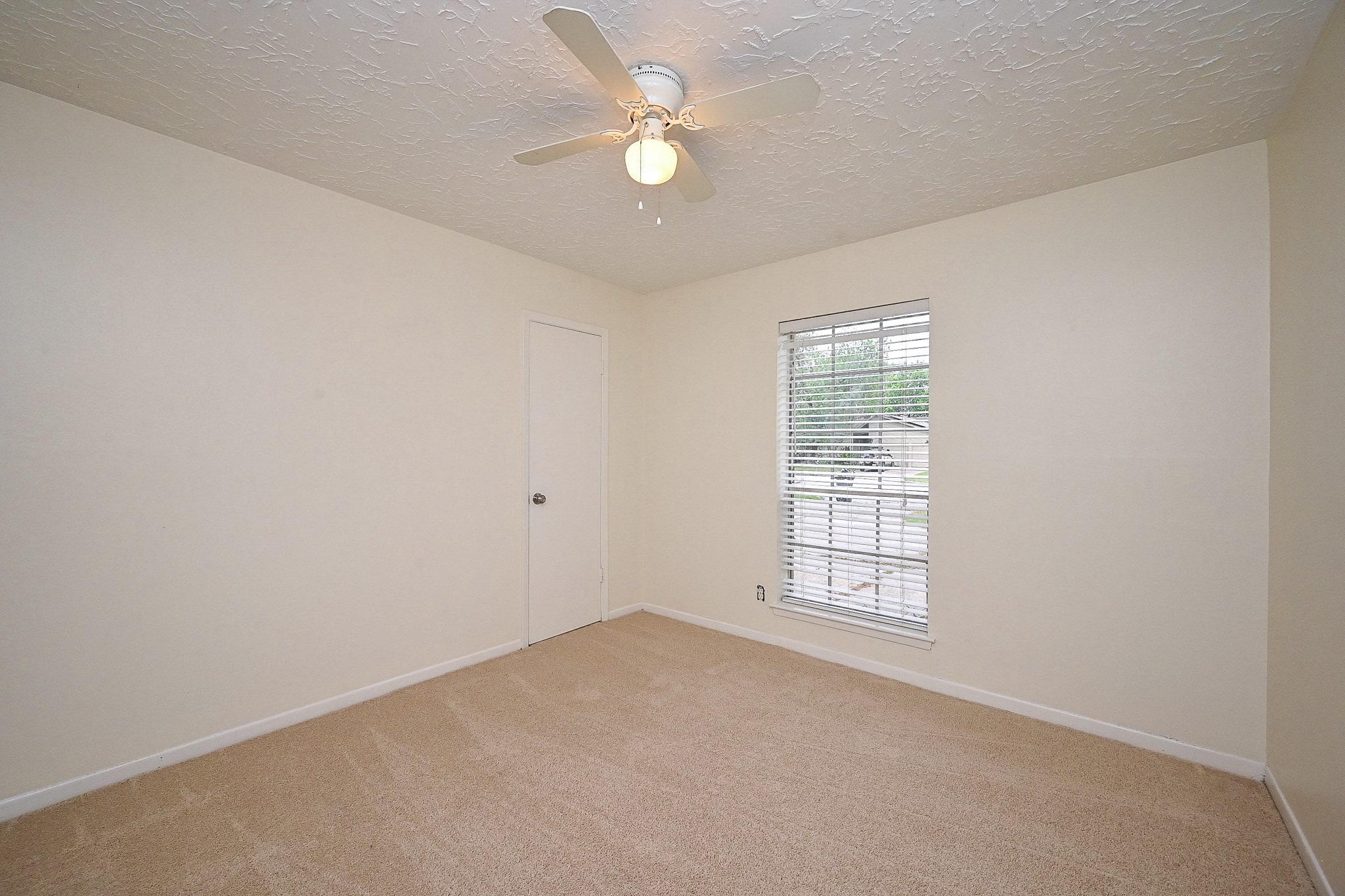 23814 Spring Gum Drive Spring, TX 77373 - Photo 13 of 21 an empty room with windows and ceiling fan