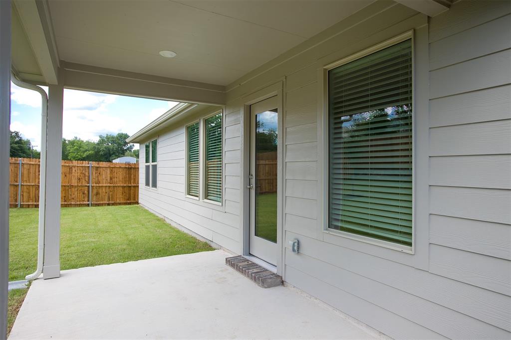 404 Castle Road Sherman, TX 75092 - Photo 22 of 25 a view of backyard with green space