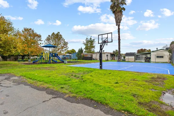 a view of a park with swings and slides