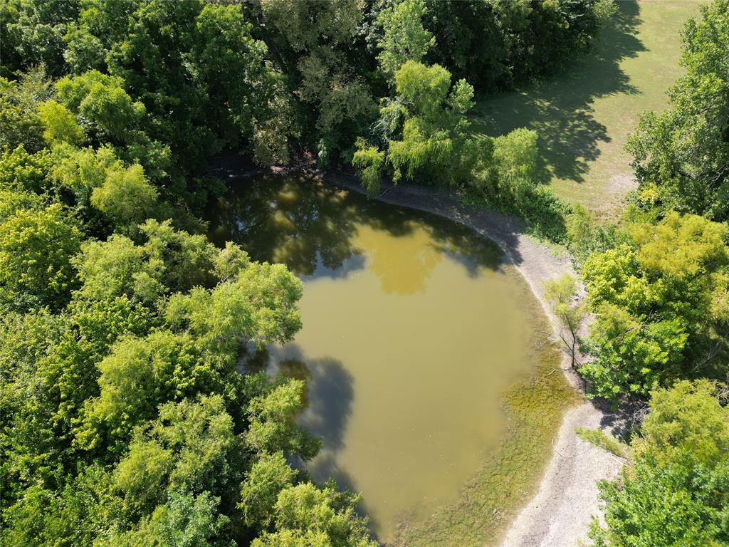 Tbd Bethel-Cannon Road Van Alstyne, TX 75495 - Photo 9 of 25 a view of a lake with a house
