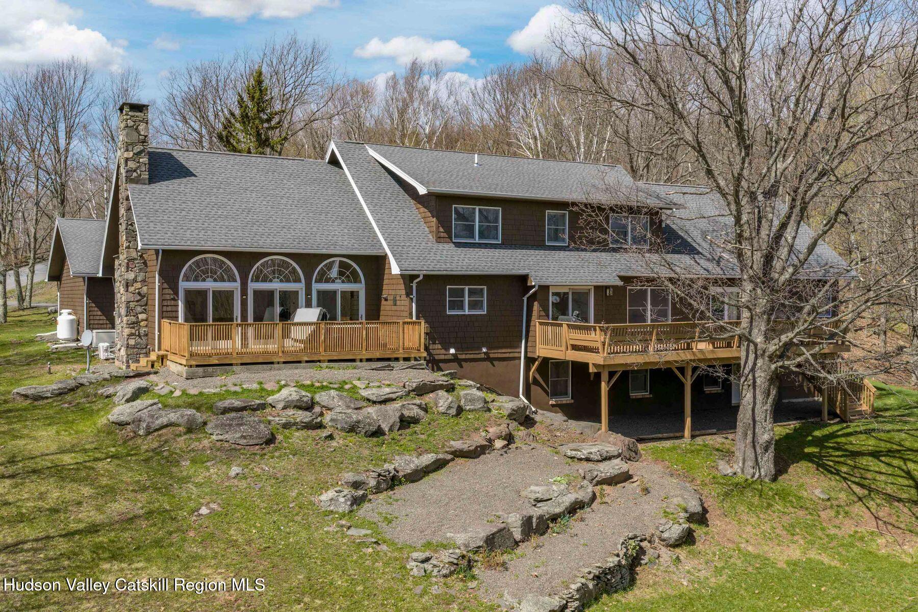 78 Buckskin Loop Windham, NY 12496 - Photo 1 of 97 a front view of a house with a yard