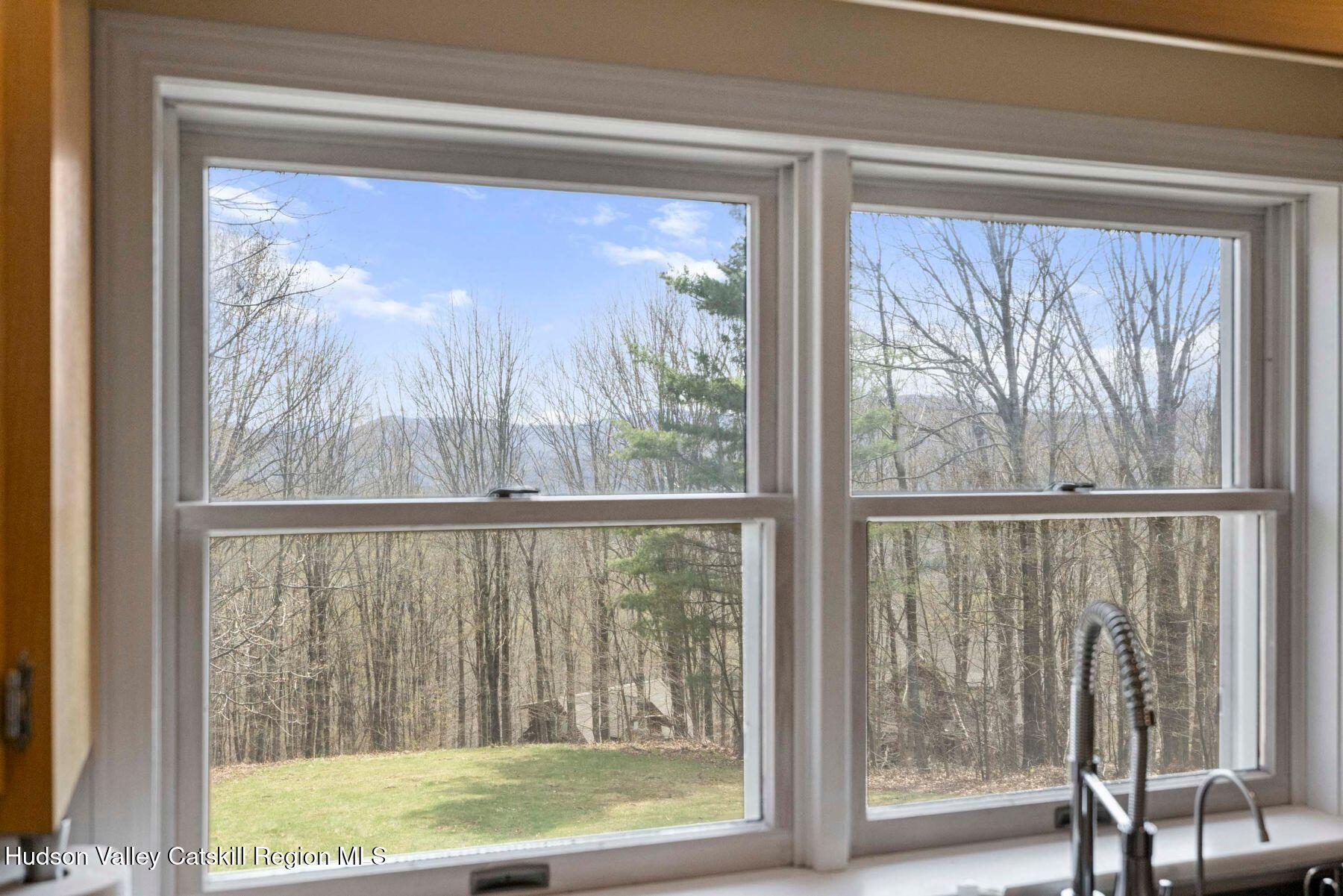 78 Buckskin Loop Windham, NY 12496 - Photo 14 of 97 a view of a room with a large window and a bed