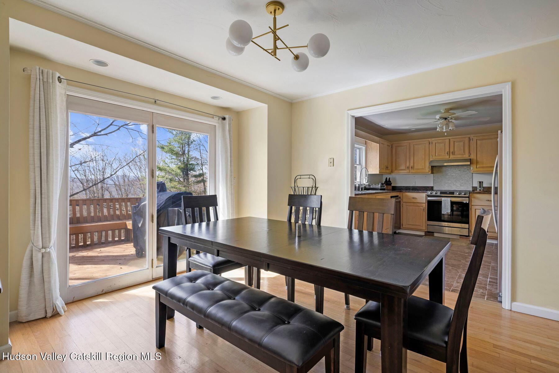 78 Buckskin Loop Windham, NY 12496 - Photo 19 of 97 a view of a dining room with furniture window and wooden floor