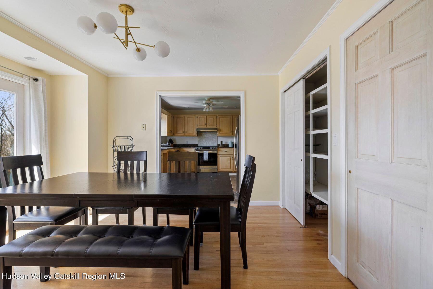 78 Buckskin Loop Windham, NY 12496 - Photo 20 of 97 a view of a dining room with furniture and wooden floor