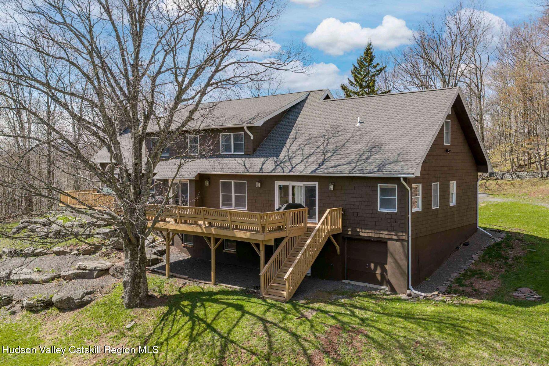 78 Buckskin Loop Windham, NY 12496 - Photo 2 of 97 a view of a house with a yard and wooden fence