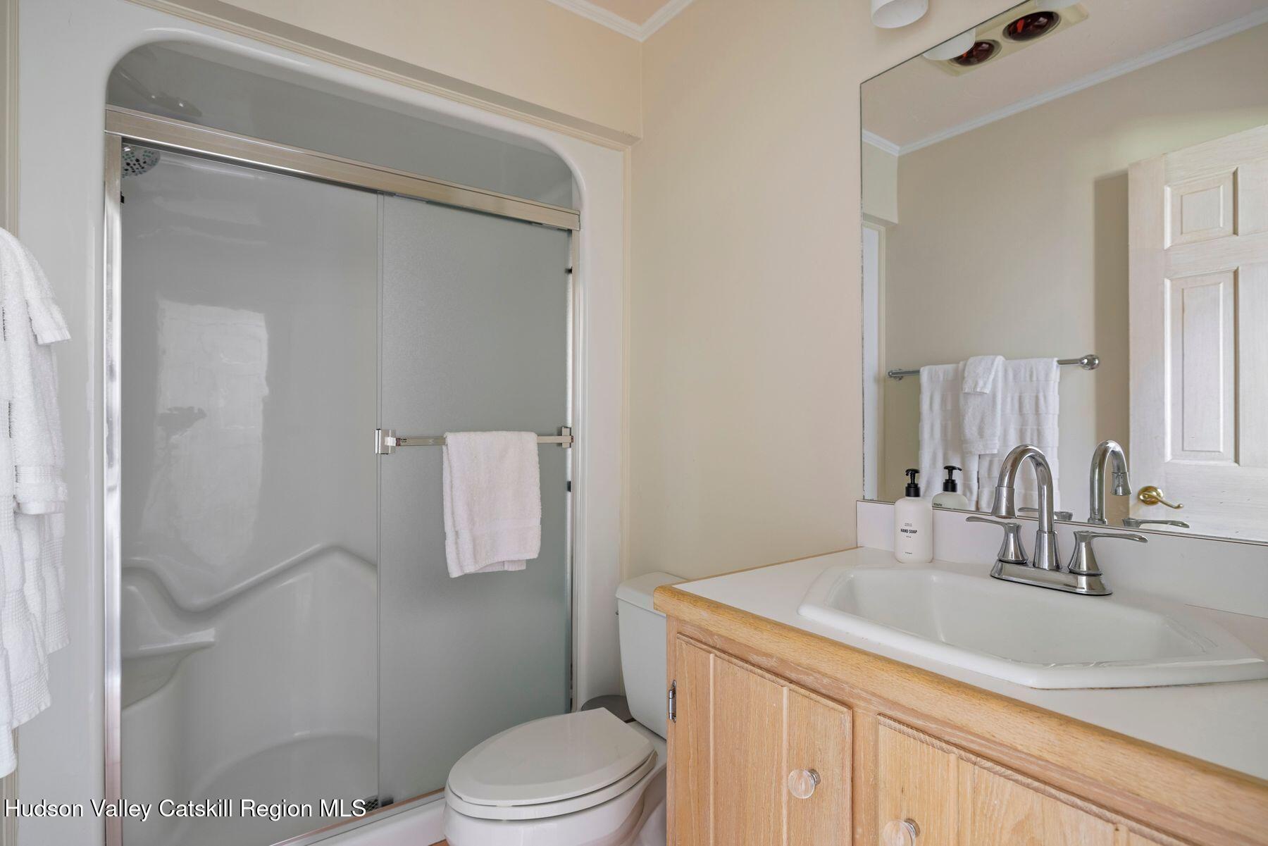 78 Buckskin Loop Windham, NY 12496 - Photo 32 of 97 a bathroom with a granite countertop sink toilet and shower