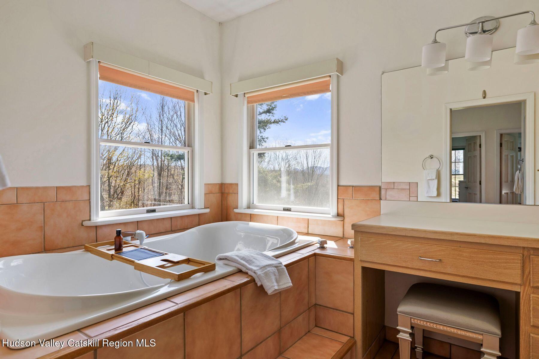 78 Buckskin Loop Windham, NY 12496 - Photo 39 of 97 a bath tub sitting next to a window