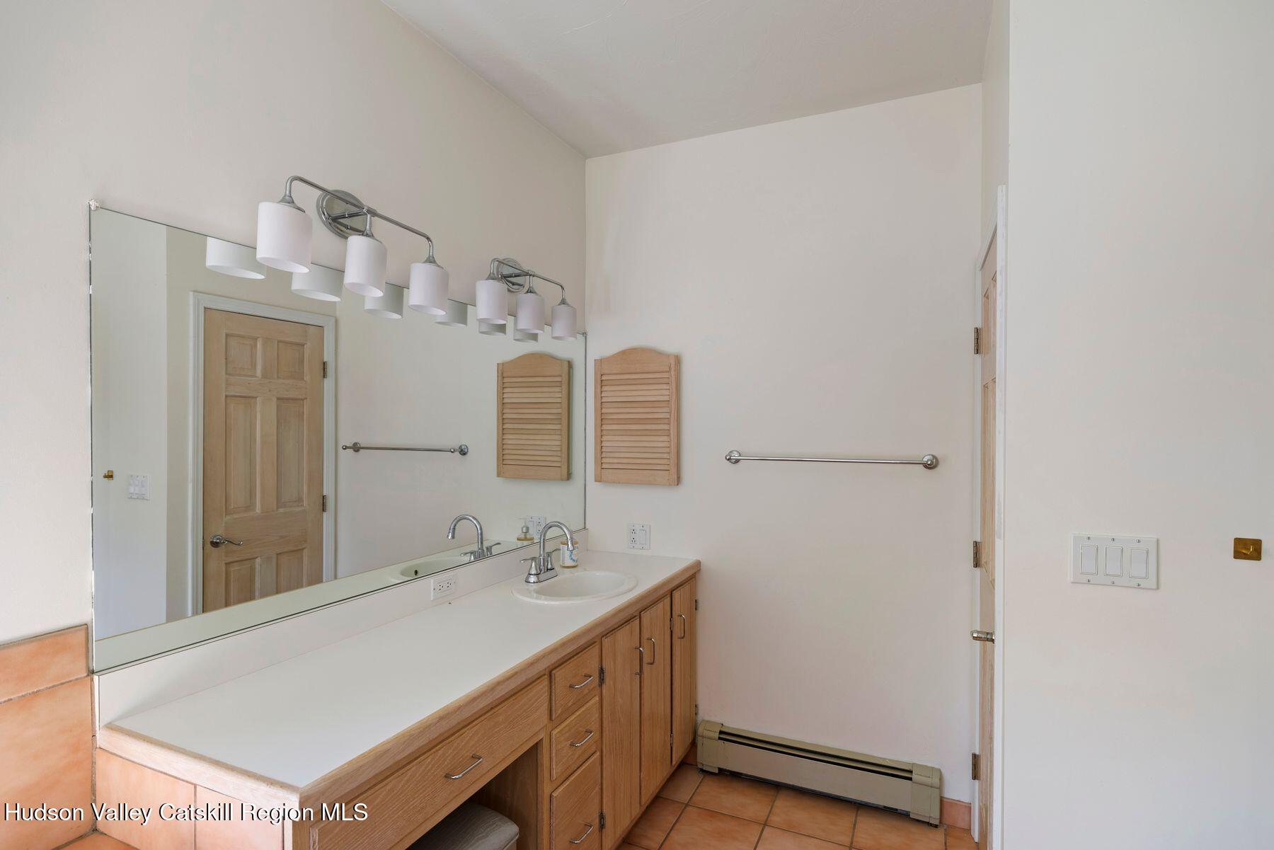 78 Buckskin Loop Windham, NY 12496 - Photo 41 of 97 a bathroom with a sink and a mirror
