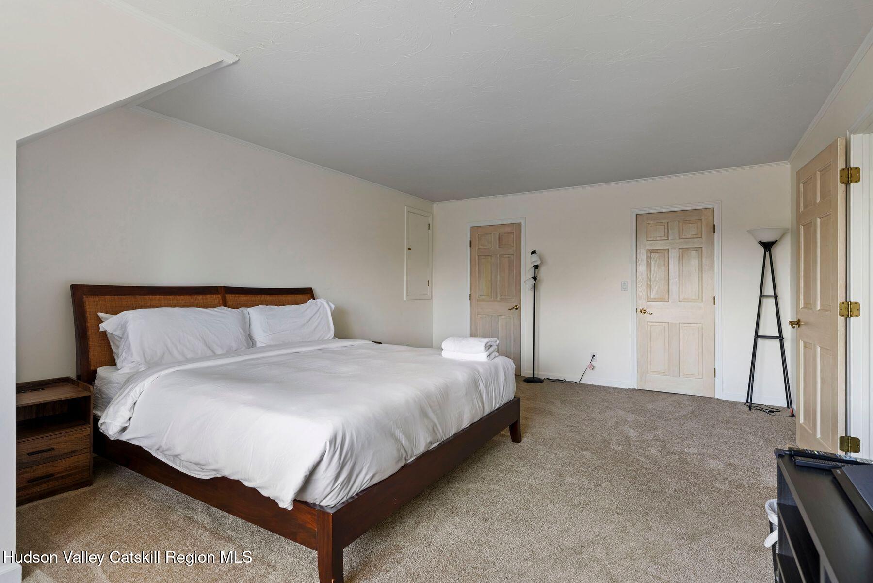 78 Buckskin Loop Windham, NY 12496 - Photo 50 of 97 a large bed sitting in a bedroom and a table
