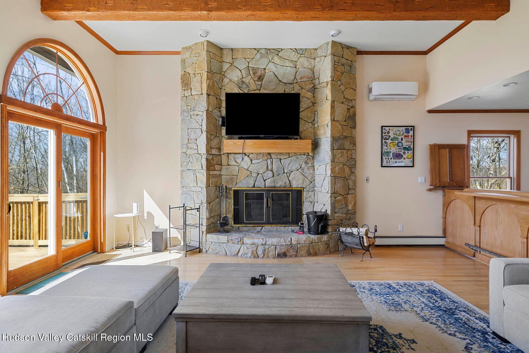 78 Buckskin Loop Windham, NY 12496 - Photo 5 of 97 a living room with fireplace furniture and a fireplace