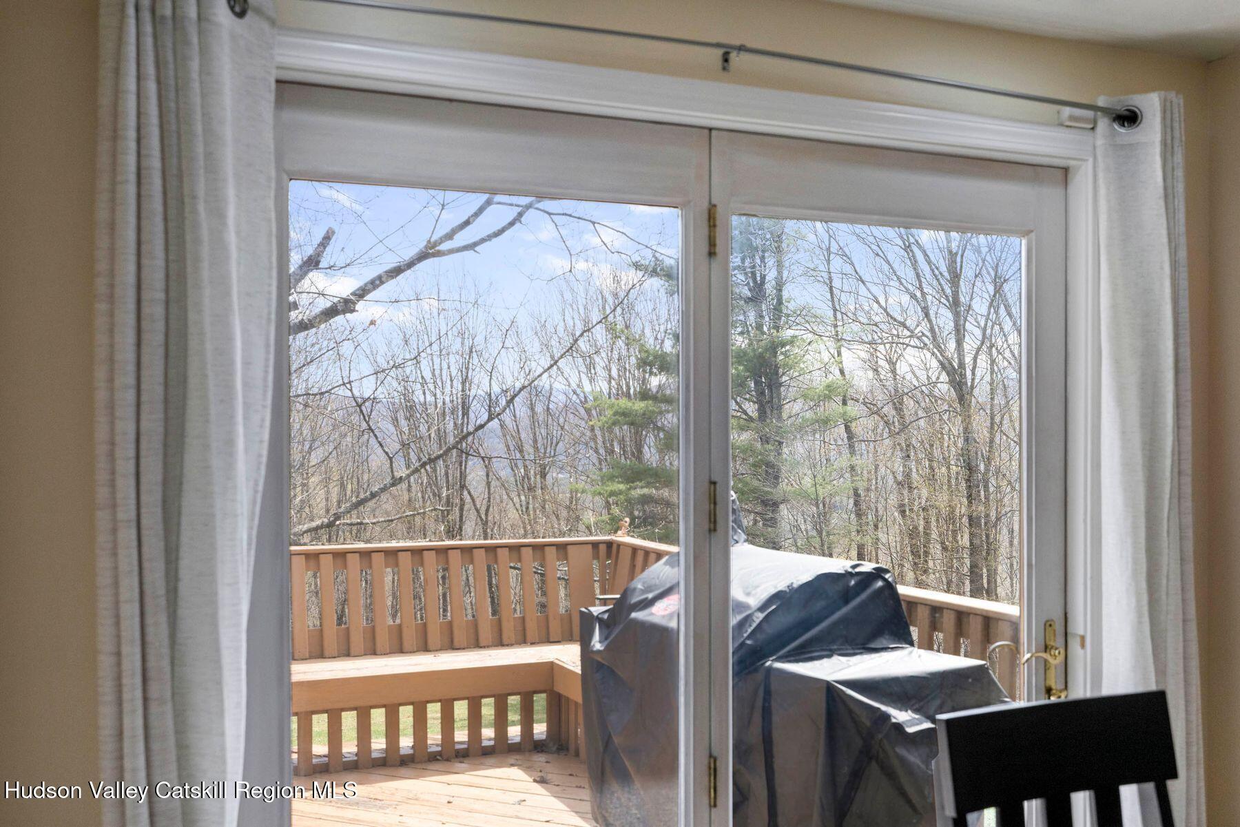 78 Buckskin Loop Windham, NY 12496 - Photo 64 of 97 a view of a room with a large window and wooden floor