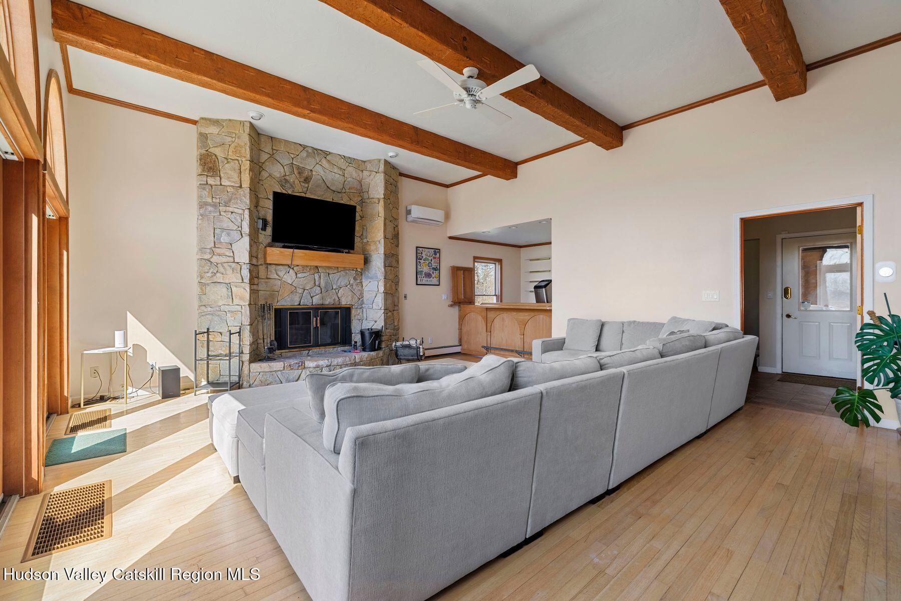 78 Buckskin Loop Windham, NY 12496 - Photo 7 of 97 a living room with furniture and a fireplace