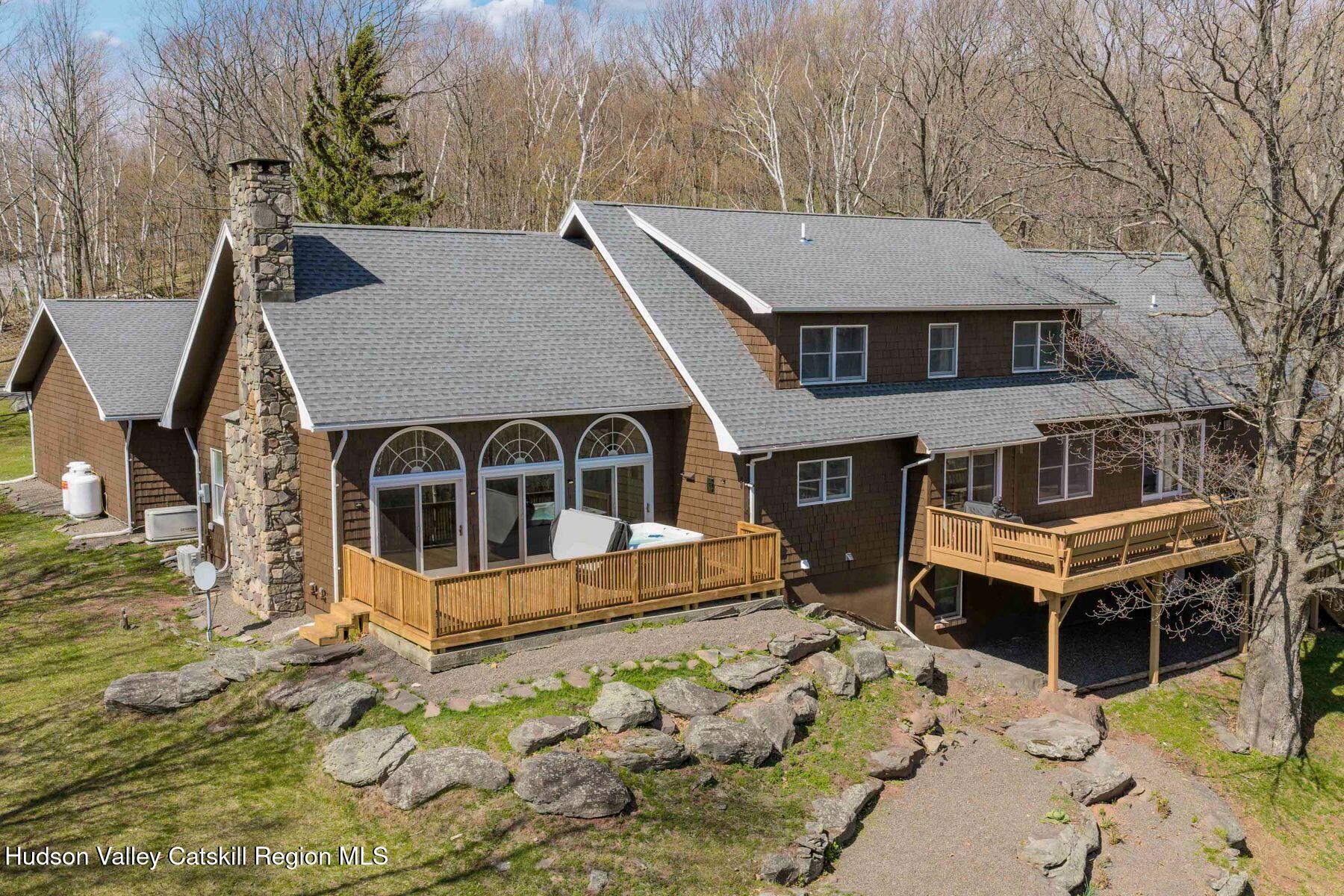 78 Buckskin Loop Windham, NY 12496 - Photo 84 of 97 a front view of a house with a yard