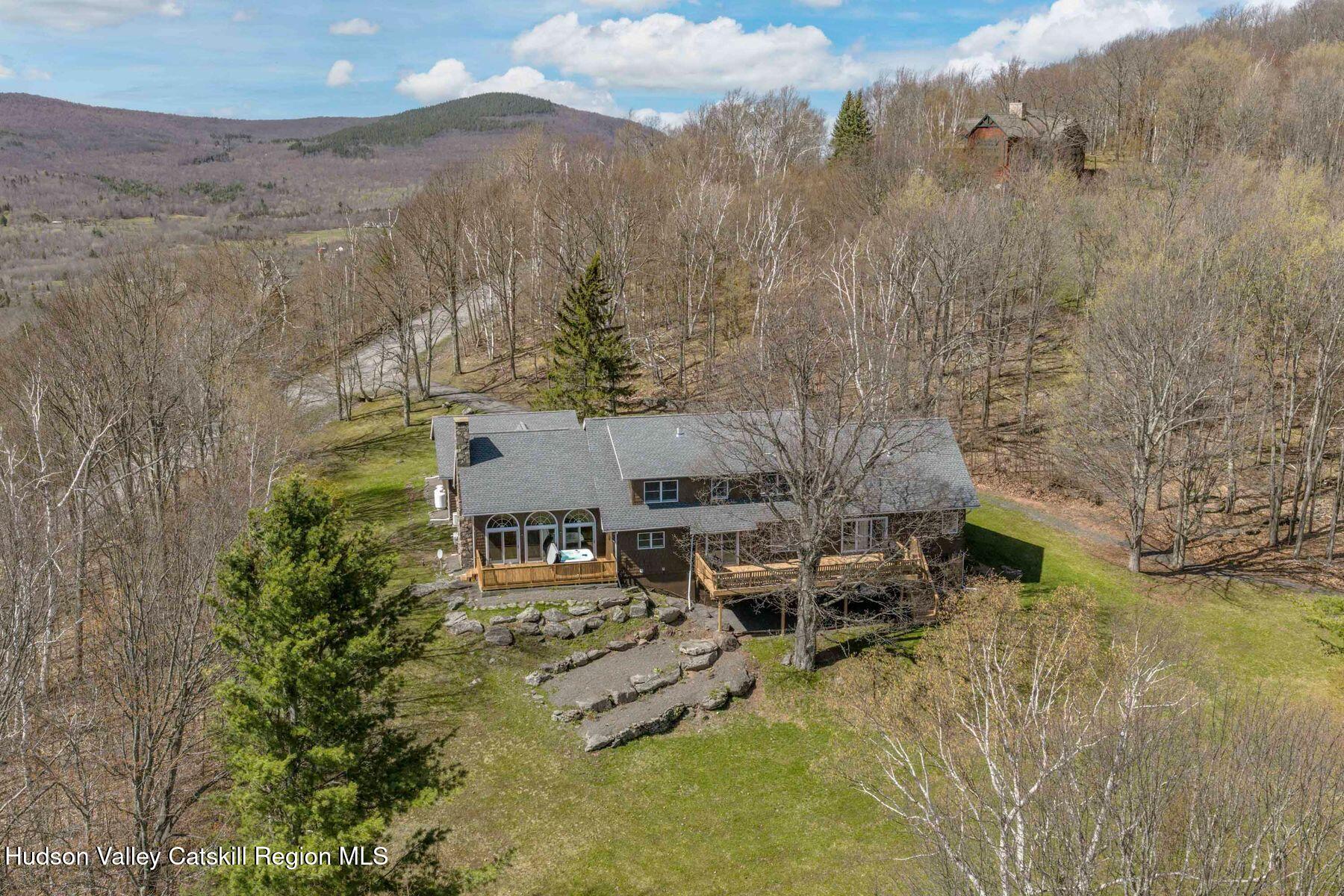 78 Buckskin Loop Windham, NY 12496 - Photo 88 of 97 an aerial view of a house with a yard and large tree