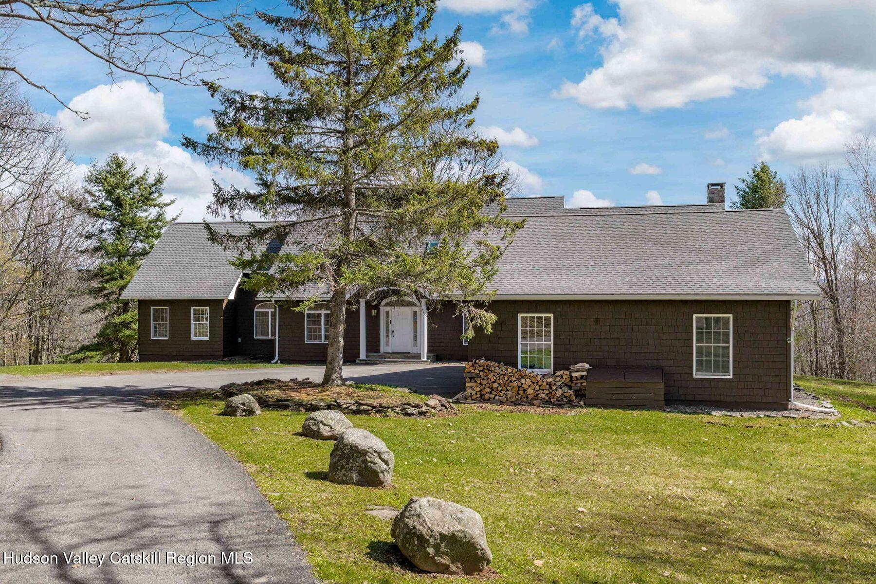 78 Buckskin Loop Windham, NY 12496 - Photo 89 of 97 a front view of a house with swimming pool and porch