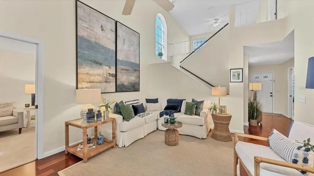 a living room with furniture and a mirror