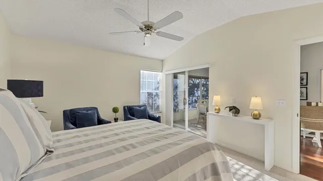 a bedroom with a bed and a large mirror