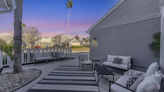 a view of a two chairs in the patio
