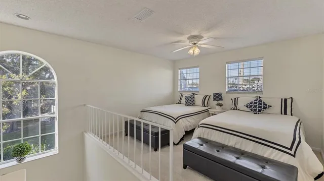 a bedroom with furniture and a chandelier