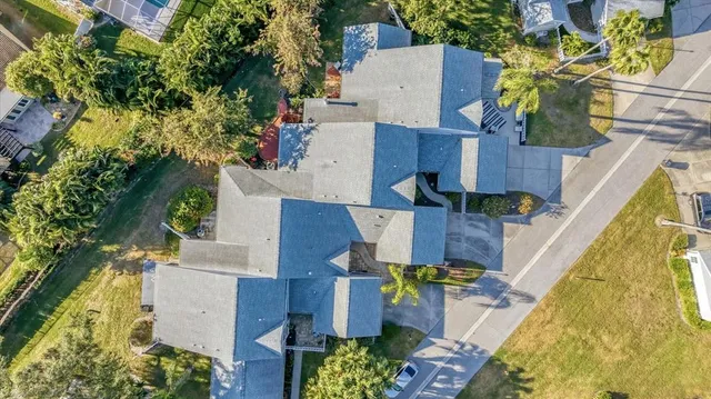 an aerial view of residential houses with outdoor space