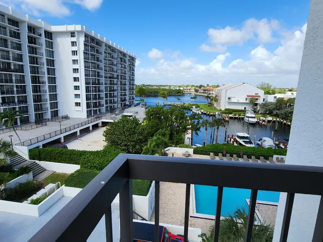 a view of a balcony with chairs