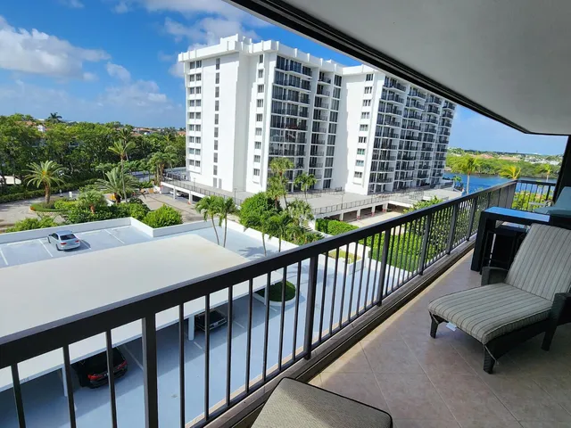 a view of a hallway with furniture and front door