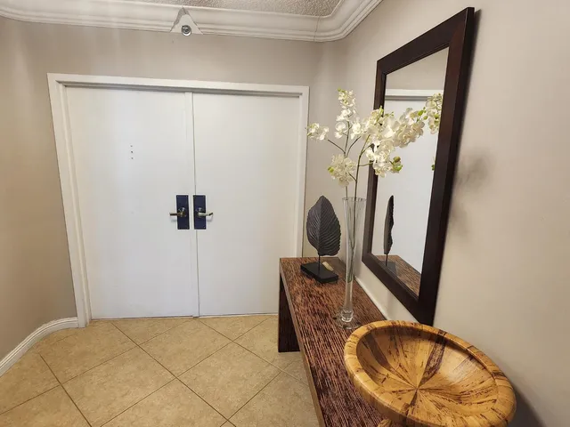 a kitchen with kitchen island granite countertop a sink stove and cabinets