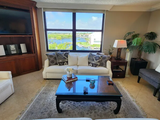 a view of a livingroom with furniture and a window