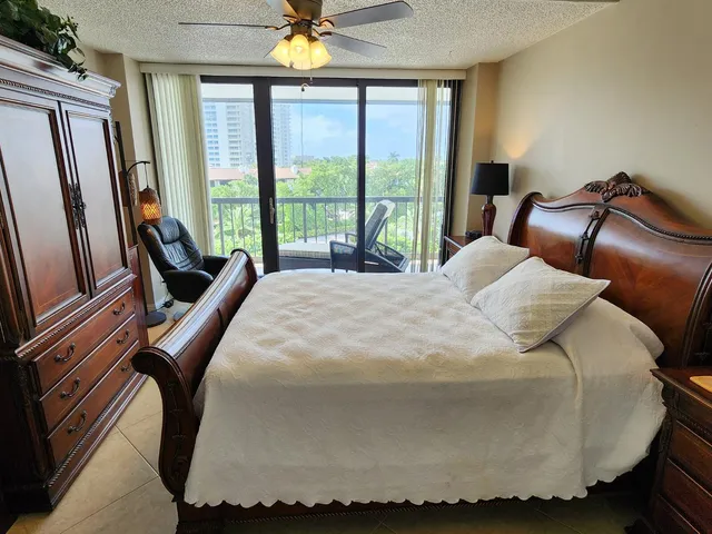 a bedroom with bed and window