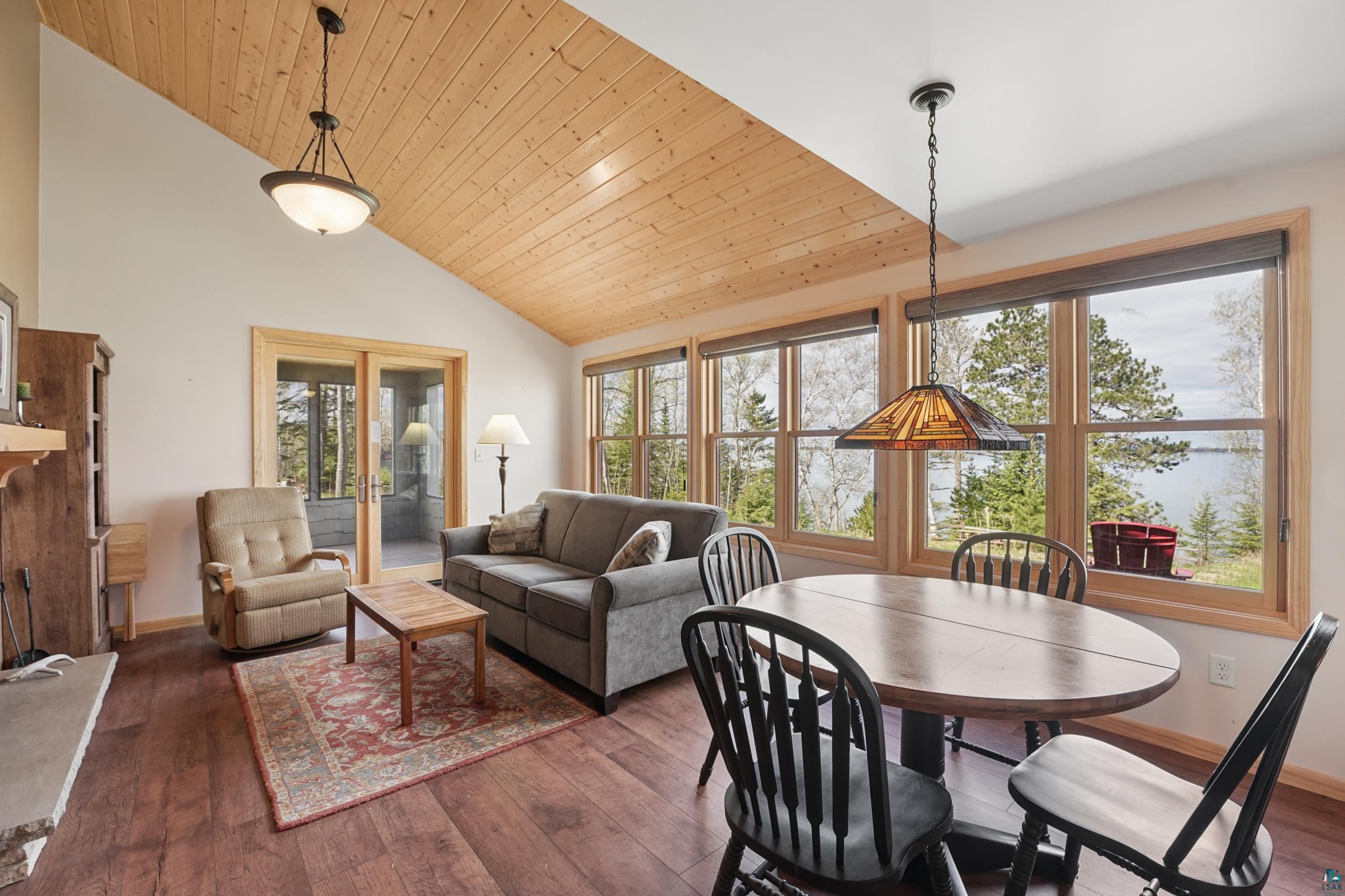89095 West Romans Point Road Herbster, WI 54844 - Photo 12 of 30 Living area featuring wood-finish flooring, a wood plank vaulted ceiling, and recessed lighting