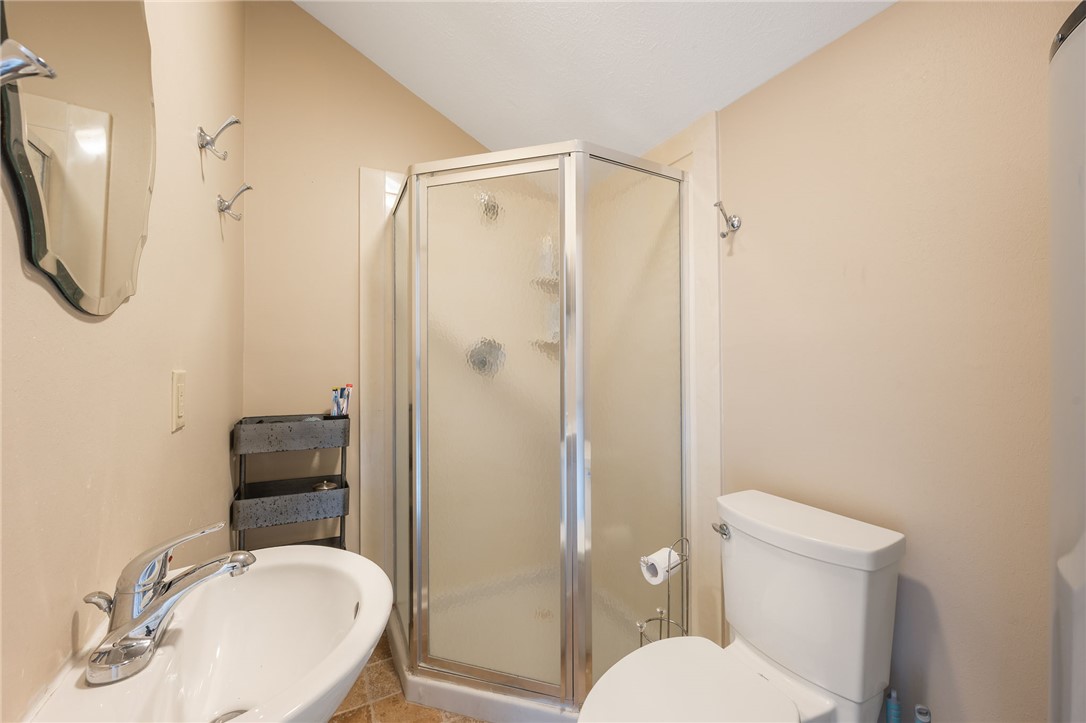715 Inwood Drive Bryan, TX 77802 - Photo 15 of 34 a bathroom with a sink toilet and shower