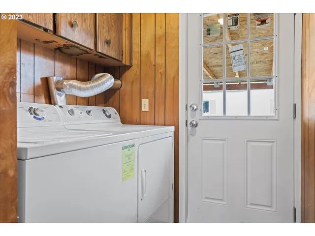 a utility room with dryer and washer