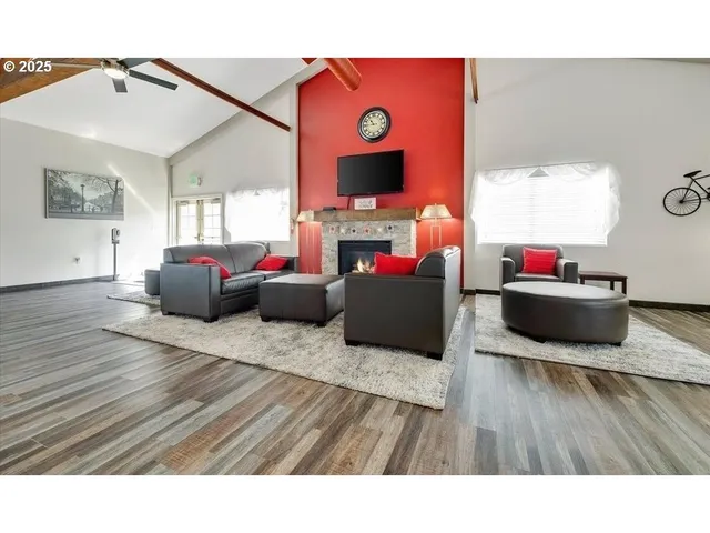 a living room with furniture flat screen tv and a fireplace