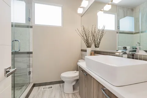 a balcony with wooden floor table and chairs