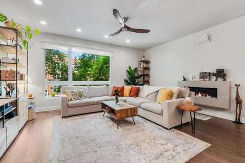 a bedroom with furniture and a window