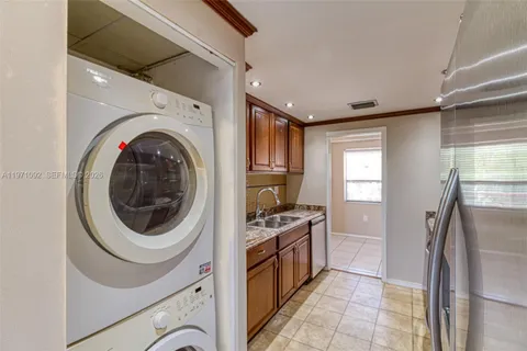 a kitchen with a washer and dryer