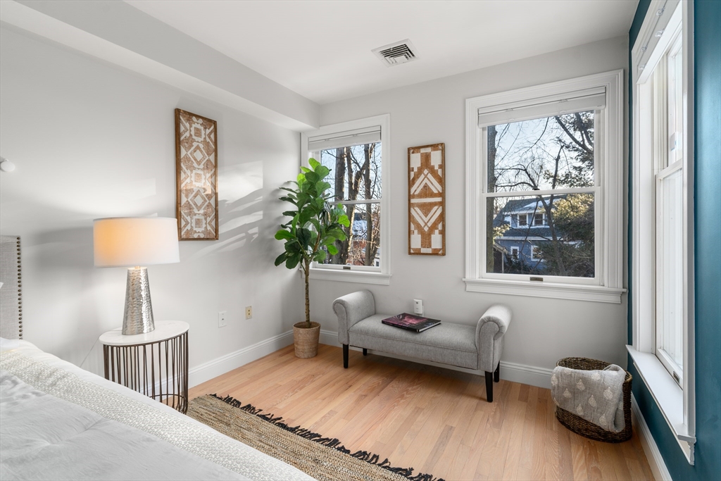 334 Beacon Street, Unit B Somerville, MA 02143 - Photo 17 of 23 a bedroom with furniture and a window