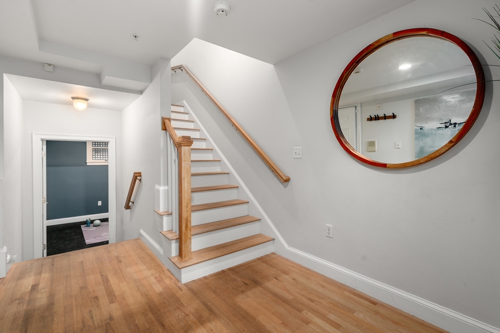 334 Beacon Street, Unit B Somerville, MA 02143 - Photo 21 of 23 a view of a room with wooden floor and entryway