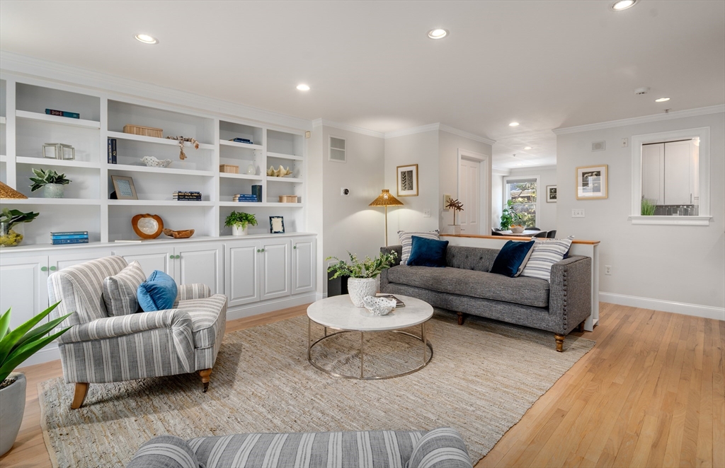 334 Beacon Street, Unit B Somerville, MA 02143 - Photo 5 of 23 a living room with furniture and a wooden floor