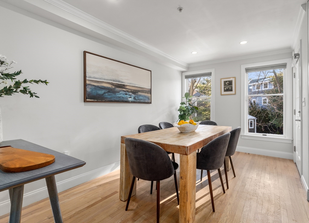 334 Beacon Street, Unit B Somerville, MA 02143 - Photo 6 of 23 a view of a dining room with furniture and wooden floor