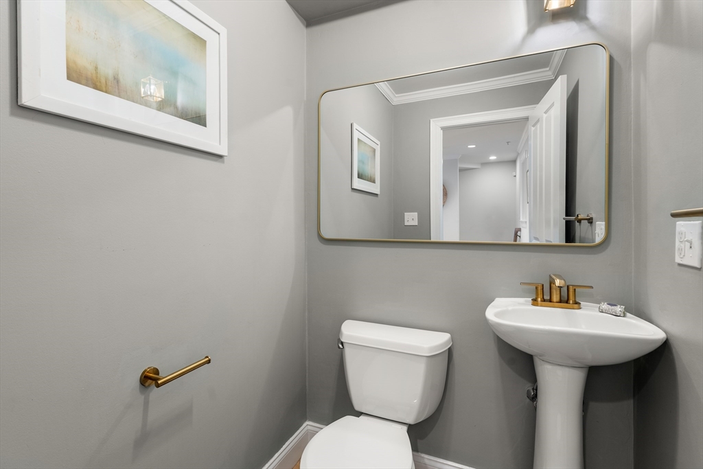 334 Beacon Street, Unit B Somerville, MA 02143 - Photo 10 of 23 a bathroom with a toilet sink and mirror