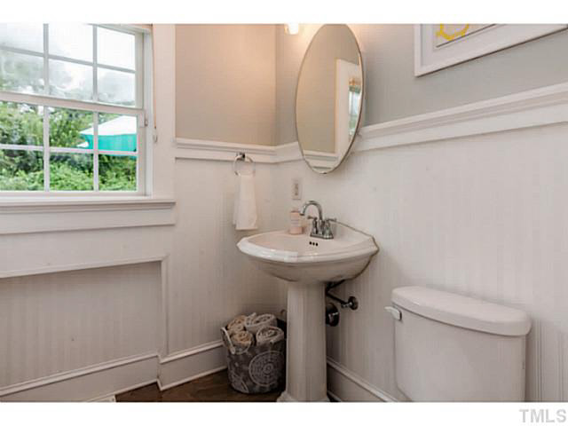 111 North King Charles Road Raleigh, NC 27610 - Photo 11 of 25 a bathroom with a sink and a mirror
