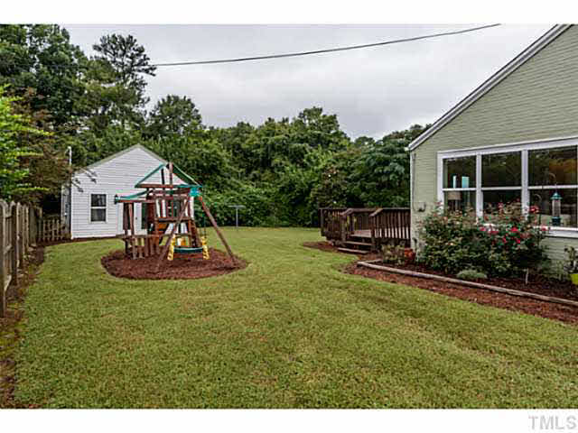 111 North King Charles Road Raleigh, NC 27610 - Photo 22 of 25 a view of a house with backyard and sitting area