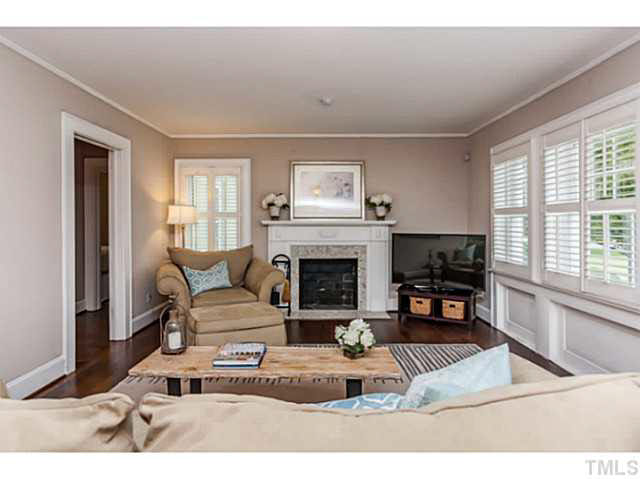 111 North King Charles Road Raleigh, NC 27610 - Photo 9 of 25 a living room with furniture and a fireplace