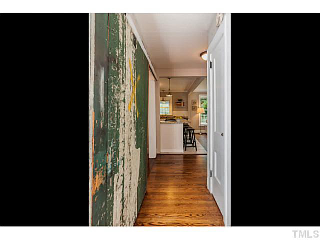 111 North King Charles Road Raleigh, NC 27610 - Photo 10 of 25 a view of a hallway with wooden floor