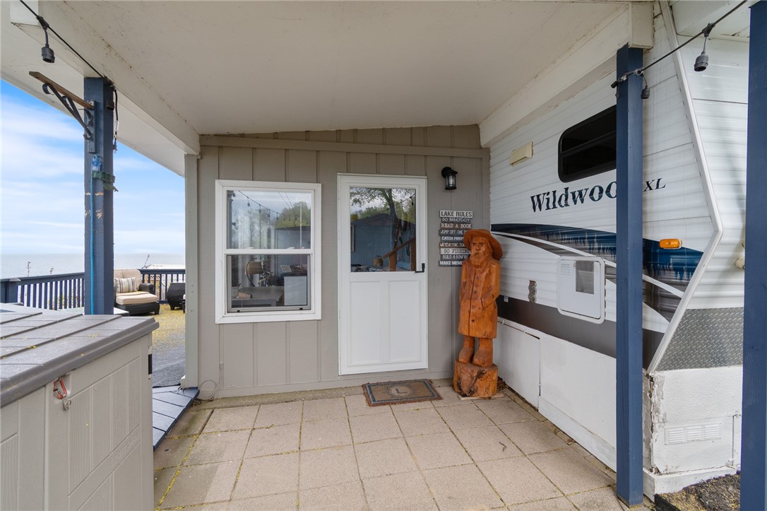 7945 Lake Road, Unit 86 Sodus, NY 14555 - Photo 10 of 22 The COVERD ENTRYWAY - easy access and the stonewor