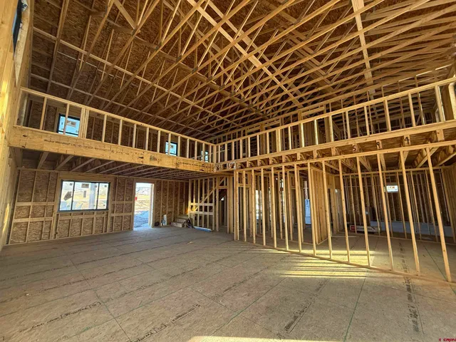 a front view of a building with a yard