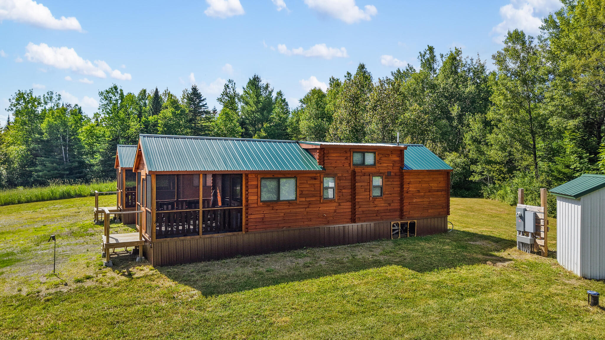 824 Shin Pond Road Patten, ME 04765 - Photo 6 of 49 dji_fly_20260712_155132_0821_17839006711
